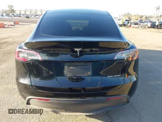2023 Tesla Model Y Long Range z VIN 7SAYGAEEXPF673871, wystawiony jako IAAI lot #41980174 z przebiegiem 45 870 mil mil oraz . Historia ofert i sprzedaży dostępna na DreamBid. Obrazek 16.