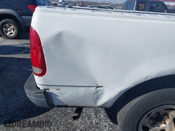 2003 Ford F-150 XL with VIN 1FTRF17W13NB65293, listed as a IAAI auction lot 41264978 with Not Provided miles and . Bid and sale history available at DreamBid. Image 12.