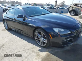 2014 BMW 6 Series 640i z VIN WBA6A0C52EDZ04606, wystawiony jako IAAI lot #41344768 z przebiegiem 75 297 mil mil oraz . Historia ofert i sprzedaży dostępna na DreamBid. Obrazek 1.