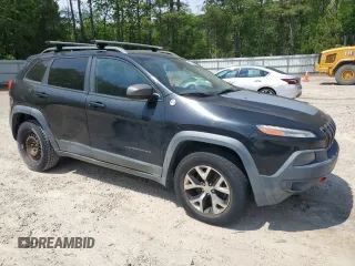 2014 Jeep Cherokee Trailhawk with VIN 1C4PJMBS1EW242527, listed as a Copart auction lot 53160485 with 104,074 mi miles and Salvage Title. Bid and sale history available at carsss.com. Image 4.
