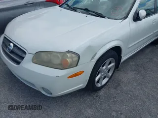 2003 Nissan Maxima SE z VIN JN1DA31DX3T501453, wystawiony jako IAAI lot #42116346 z przebiegiem 127 364 mil mil oraz . Historia ofert i sprzedaży dostępna na DreamBid. Obrazek 6.
