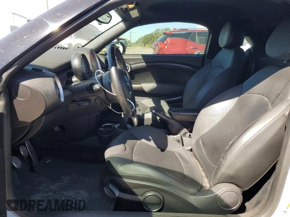 2014 MINI Coupe S z VIN WMWSX3C57ET409158, wystawiony jako Copart lot #81650034 z przebiegiem 118 523 mil mil oraz Szkoda całkowita • Salvage title. Historia ofert i sprzedaży dostępna na DreamBid. Obrazek 7.