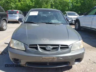 2001 Hyundai Accent GLS z VIN KMHCG35C01U136132, wystawiony jako IAAI lot #42293830 z przebiegiem 111 906 mil mil oraz . Historia ofert i sprzedaży dostępna na DreamBid. Obrazek 6.