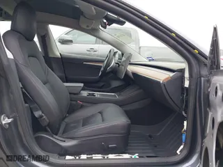 2022 Tesla Model 3 Performance with VIN 5YJ3E1EC9NF130410, listed as a IAAI auction lot 41711708 with 26,937 mi miles. Bid and sale history available at carsss.com. Image 5.