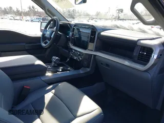2023 Ford F-150 Lightning Pro with VIN 1FTVW1EL7PWG07081, listed as a IAAI auction lot 38702102 with 9,976 mi miles and . Bid and sale history available at DreamBid. Image 5.