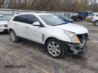 2014 Cadillac SRX Premium Collection z VIN 3GYFNDE34ES548826, wystawiony jako IAAI lot #40792942 z przebiegiem 115 984 mil mil oraz . Historia ofert i sprzedaży dostępna na DreamBid. Obrazek 1.