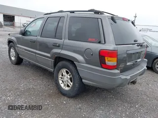 2002 Jeep Grand Cherokee with VIN 1J4GW38N62C190851, listed as a IAAI auction lot 42519384 with 142,066 mi miles and . Bid and sale history available at DreamBid. Image 3.