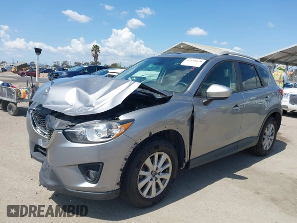 2014 Mazda CX-5 Touring z VIN JM3KE2CYXE0322943, wystawiony jako IAAI lot #41934670 z przebiegiem 110 690 mil mil oraz . Historia ofert i sprzedaży dostępna na DreamBid. Obrazek 2.