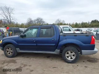 2005 Ford Explorer Sport Trac XLS with VIN 1FMZU77K35UA59213, listed as a IAAI auction lot 41690884 with 219,652 mi miles. Bid and sale history available at carsss.com. Image 14.