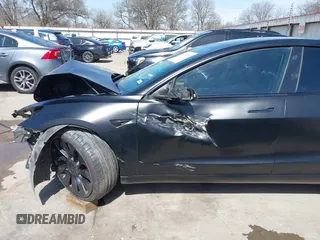 2022 Tesla Model 3 Performance with VIN 5YJ3E1EC6NF104475, listed as a IAAI auction lot 41734724 with 31,717 mi miles and . Bid and sale history available at carsss.com. Image 19.