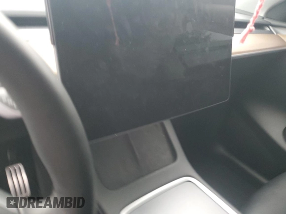 2022 Tesla Model Y Performance с VIN 7SAYGDEF5NF554018, выставлен на аукционе Copart как лот 65062185 с пробегом Не указан миль и Списание • Salvage title. История ставок и продаж доступна на DreamBid. Изображение 9.