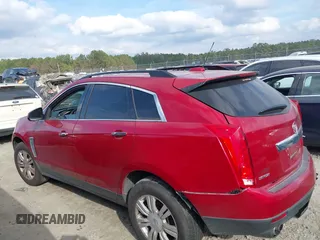 2015 Cadillac SRX z VIN 3GYFNAE3XFS572970, wystawiony jako IAAI lot #40854902 z przebiegiem 124 779 mil mil oraz . Historia ofert i sprzedaży dostępna na DreamBid. Obrazek 13.
