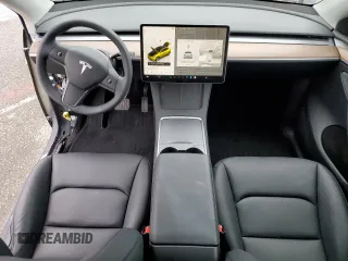 2024 Tesla Model Y with VIN 7SAYGDED5RF093410, listed as a Copart auction lot 50557225 with 6,396 mi miles and Salvage Title. Bid and sale history available at DreamBid. Image 8.