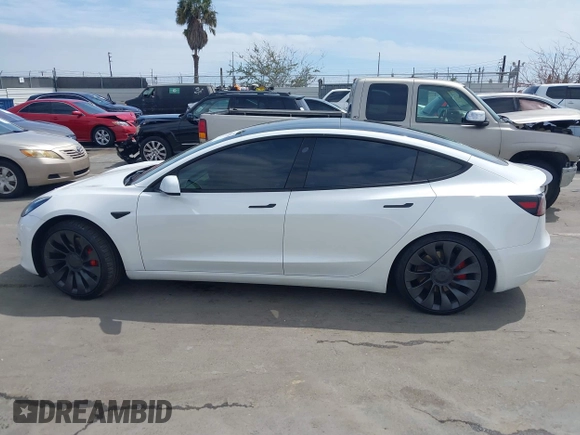 2021 Tesla Model 3 Performance with VIN 5YJ3E1EC2MF084594, listed as a IAAI auction lot 42030339 with 43,215 mi miles and . Bid and sale history available at DreamBid. Image 14.