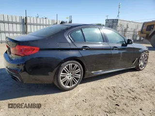 2019 BMW 5 Series M550i xDrive with VIN WBAJB9C50KB464503, listed as a Copart auction lot 56995825 with 67,324 mi miles and Salvage title. Bid and sale history available at DreamBid. Image 3.
