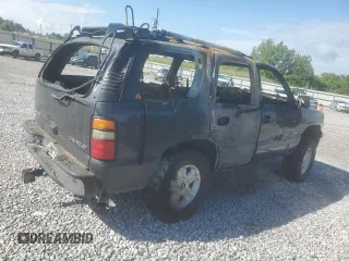 2003 Chevrolet Tahoe LS z VIN 1GNEC13Z03J273863, wystawiony jako Copart lot #56574255 z przebiegiem Nie podano mil oraz Szkoda całkowita • Salvage title. Historia ofert i sprzedaży dostępna na DreamBid. Obrazek 3.