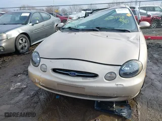 1999 Ford Taurus SE with VIN 1FAFP53U3XA131984, listed as a IAAI auction lot 41638566 with 84,836 mi miles. Bid and sale history available at carsss.com. Image 12.