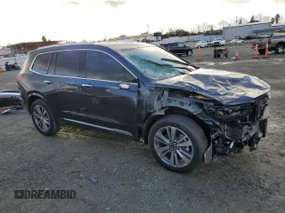 2021 Cadillac XT6 Premium Luxury with VIN 1GYKPERS3MZ150928, listed as a Copart auction lot 86551144 with 12,311 mi miles and Salvage title. Bid and sale history available at DreamBid. Image 4.