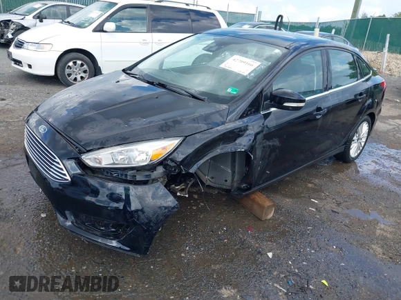 2016 Ford Focus Titanium z VIN 1FADP3J27GL215436, wystawiony jako IAAI lot #42709166 z przebiegiem 75 956 mil mil oraz . Historia ofert i sprzedaży dostępna na DreamBid. Obrazek 18.