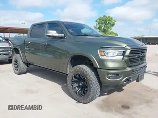 2021 Ram 1500 Laramie with VIN 1C6SRFJT1MN797241, listed as a IAAI auction lot 42537331 with 48,831 mi miles and . Bid and sale history available at DreamBid. Image 1.