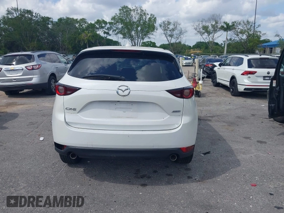 2018 Mazda CX-5 Touring z VIN JM3KFACM6J1419663, wystawiony jako IAAI lot #41879677 z przebiegiem 115 224 mil mil oraz . Historia ofert i sprzedaży dostępna na DreamBid. Obrazek 16.