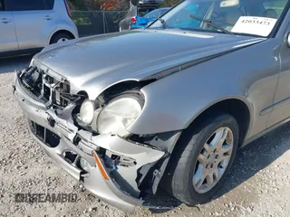 2003 Mercedes-Benz E-Class 3.2L with VIN WDBUF65J93X099223, listed as a IAAI auction lot 42033473 with 230,758 mi miles. Bid and sale history available at carsss.com. Image 18.