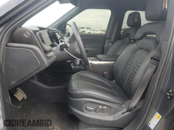2023 Rivian R1T Adventure with VIN 7FCTGAAA3PN000801, listed as a Copart auction lot 51600895 with 19,486 mi miles and Salvage Title. Bid and sale history available at carsss.com. Image 7.