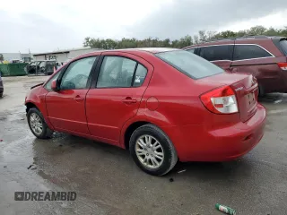 2013 Suzuki SX4 LE with VIN JS2YC5A36D6101956, listed as a Copart auction lot 84450374 with 61,704 mi miles and Salvage Title. Bid and sale history available at carsss.com. Image 2.