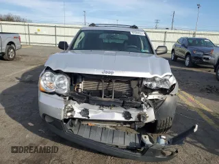 2009 Jeep Grand Cherokee Laredo with VIN 1J8HR48P89C552691, listed as a Copart auction lot 82080964 with 100,876 mi miles and Salvage Title. Bid and sale history available at carsss.com. Image 5.