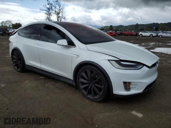 2016 Tesla Model X 70D with VIN 5YJXCAE28GF017100, listed as a Copart auction lot 50081235 with 126,962 mi miles and Salvage Title. Bid and sale history available at DreamBid. Image 4.