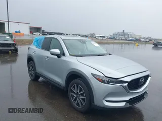 2018 Mazda CX-5 Grand Touring z VIN JM3KFBDMXJ0420129, wystawiony jako IAAI lot #42119506 z przebiegiem 67 242 mil mil oraz . Historia ofert i sprzedaży dostępna na DreamBid. Obrazek 1.
