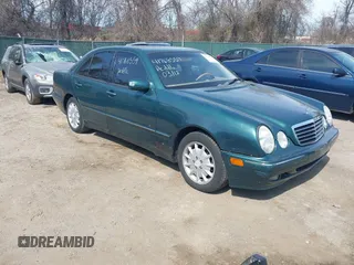 2000 Mercedes-Benz E-Class with VIN WDBJF65J1YB163391, listed as a IAAI auction lot 41768559 with 157,556 mi miles. Bid and sale history available at carsss.com. Image 1.