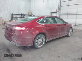 2014 Ford Fusion SE Hybrid with VIN 3FA6P0LU5ER136237, listed as a IAAI auction lot 41590088 with 174,009 mi miles. Bid and sale history available at carsss.com. Image 4.