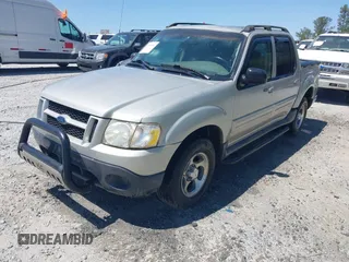 2005 Ford Explorer Sport Trac XLS z VIN 1FMZU67KX5UA59400, wystawiony jako IAAI lot #42051254 z przebiegiem 208 576 mil mil oraz . Historia ofert i sprzedaży dostępna na DreamBid. Obrazek 2.