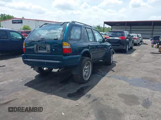 1999 Isuzu Rodeo S z VIN 4S2CK58W6X4332027, wystawiony jako IAAI lot #42087396 z przebiegiem 258 508 mil mil oraz . Historia ofert i sprzedaży dostępna na DreamBid. Obrazek 4.