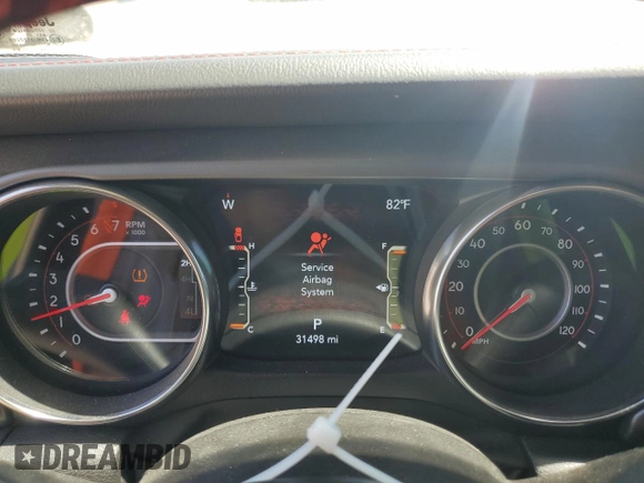 2022 Jeep Gladiator Rubicon z VIN 1C6JJTBG6NL104521, wystawiony jako Copart lot #57325365 z przebiegiem 31 498 mil mil oraz Szkoda całkowita • Salvage title. Historia ofert i sprzedaży dostępna na DreamBid. Obrazek 9.