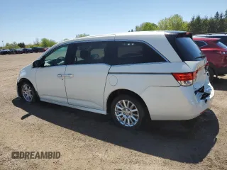 2015 Honda Odyssey Touring Elite with VIN 5FNRL5H92FB504977, listed as a Copart auction lot 56657195 with 189,438 mi miles and Salvage title. Bid and sale history available at DreamBid. Image 2.