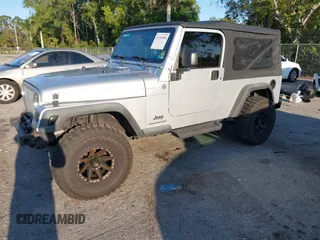 2005 Jeep Wrangler Unlimited with VIN 1J4FA44S65P335444, listed as a IAAI auction lot 41731093 with 143,918 mi miles. Bid and sale history available at carsss.com. Image 2.