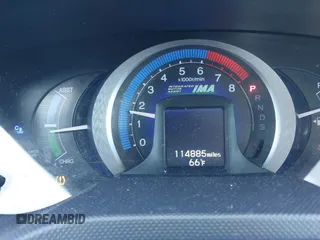 2010 Honda Insight EX with VIN JHMZE2H74AS013148, listed as a IAAI auction lot 42194894 with 114,885 mi miles and . Bid and sale history available at DreamBid. Image 7.
