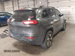 2016 Jeep Cherokee Trailhawk with VIN 1C4PJMBS2GW309042, listed as a IAAI auction lot 41564925 with 125,436 mi miles. Bid and sale history available at carsss.com. Image 4.