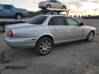 2004 Jaguar XJ with VIN SAJEA71C54SG01326, listed as a Copart auction lot 77449324 with 72,935 mi miles and Salvage Title. Bid and sale history available at carsss.com. Image 3.