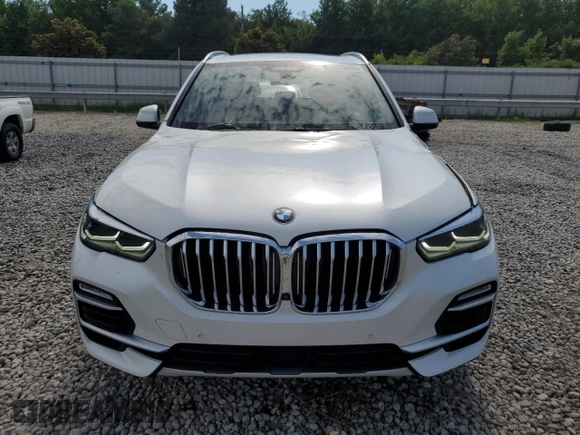 2019 BMW X5 xDrive40i with VIN 5UXCR6C5XKLK80703, listed as a Copart auction lot 63473495 with 57,260 mi miles and Salvage title. Bid and sale history available at DreamBid. Image 5.