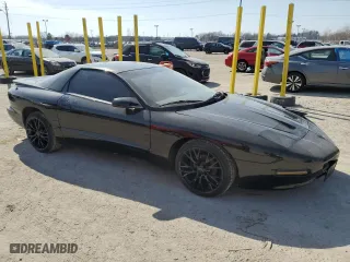 1997 Pontiac Firebird with VIN 2G2FS22K8V2212704, listed as a Copart auction lot 48853145 with 130,474 mi miles and Salvage Title. Bid and sale history available at carsss.com. Image 4.