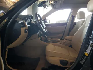 2013 BMW X1 28i z VIN WBAVM1C50DVW43672, wystawiony jako Copart lot #60318395 z przebiegiem 59 636 mil mil oraz Szkoda całkowita • Salvage title. Historia ofert i sprzedaży dostępna na DreamBid. Obrazek 7.