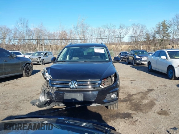2014 Volkswagen Tiguan S z VIN WVGBV3AX4EW581302, wystawiony jako IAAI lot #41033175 z przebiegiem 69 791 mil mil oraz . Historia ofert i sprzedaży dostępna na DreamBid. Obrazek 12.