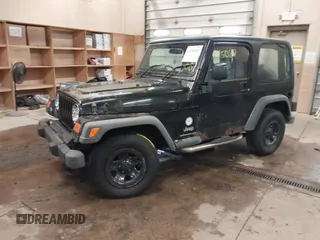 2003 Jeep Wrangler Sport Right Hand Drive with VIN 1J4F449S63P359031, listed as a IAAI auction lot 41495087 with 126,678 mi miles. Bid and sale history available at carsss.com. Image 2.