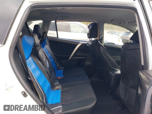 2018 Toyota RAV4 LE with VIN JTMBFREV5JJ738405, listed as a IAAI auction lot 41956145 with 100,593 mi miles and . Bid and sale history available at DreamBid. Image 8.