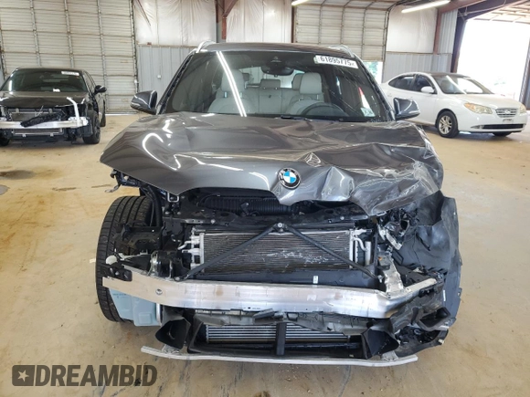 2021 BMW X1 xDrive28i with VIN WBXJG9C00M5S35249, listed as a Copart auction lot 61895775 with 34,641 mi miles and Salvage title. Bid and sale history available at DreamBid. Image 5.