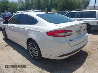 2017 Ford Fusion Titanium z VIN 3FA6P0SU0HR329224, wystawiony jako IAAI lot #42291605 z przebiegiem 176 728 mil mil oraz . Historia ofert i sprzedaży dostępna na DreamBid. Obrazek 3.