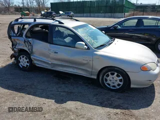 2000 Hyundai Elantra z VIN KMHJW35F1YU175682, wystawiony jako IAAI lot #41882756 z przebiegiem 96 191 mil mil oraz . Historia ofert i sprzedaży dostępna na DreamBid. Obrazek 1.